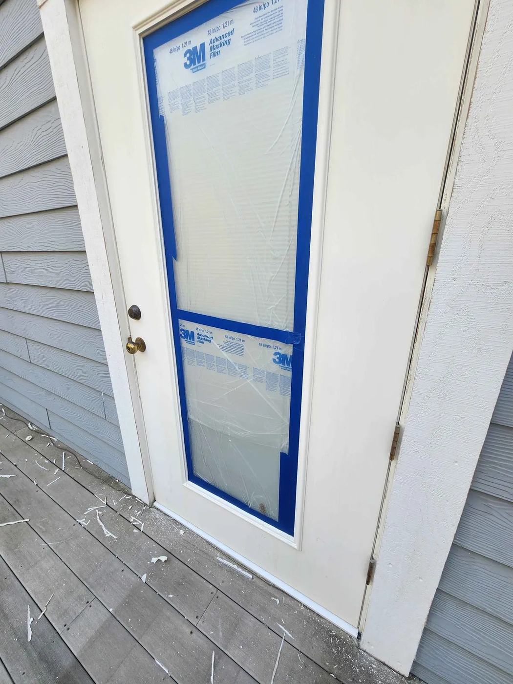 A door masked up and painted