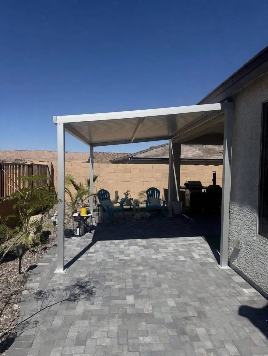 A patio cover over a paved terrace